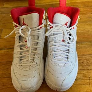 White/University red Jordan 12s. Size 6 in youth, 7.5 in women’s, and 6 in men’s